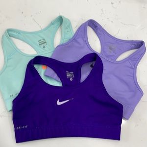 Three Nike sports bras